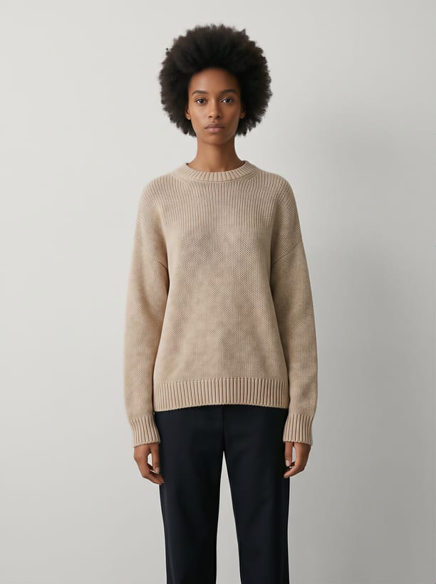 A sweater on a model, shot for a marketplace listing.